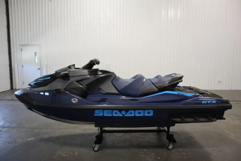 Slide: The Image of 2026 Sea-Doo GTX 170 jet ski in a showroom, side view. - 22
