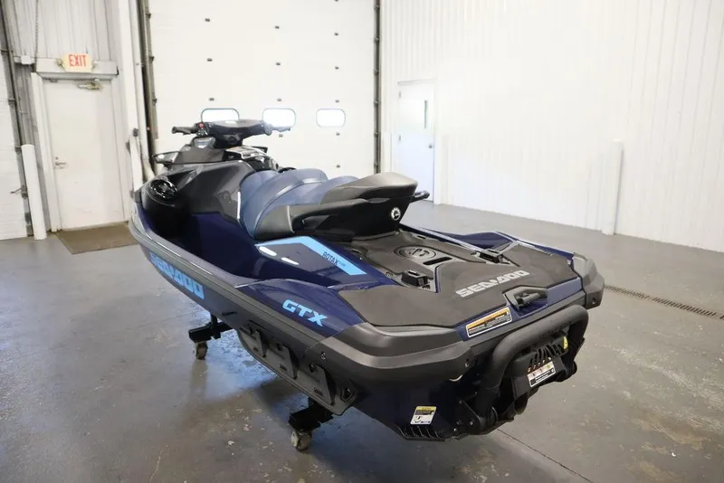 Slide: The Image of 2026 Sea-Doo GTX 170 jet ski in a garage, showcasing sleek design and modern features. - 7