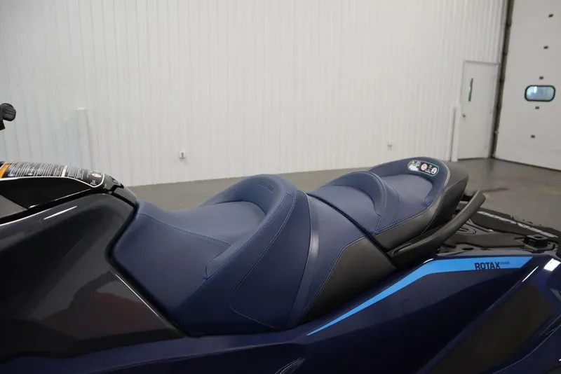 Slide: The Image of 2026 Sea-Doo GTX 170 jet ski with sleek blue seating in a showroom. - 9
