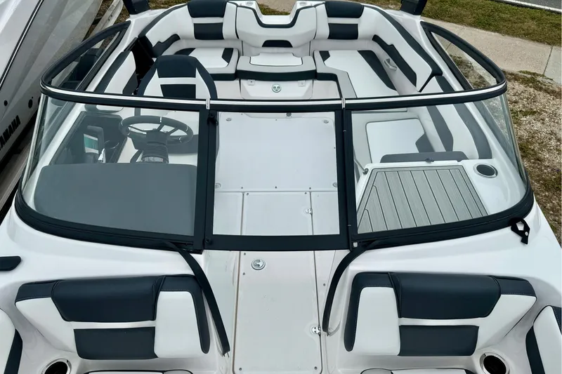 Slide: The Image of 2025 Yamaha Boats AR195 interior, featuring sleek seating and modern dashboard design. - 22