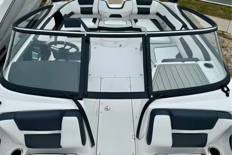 Slide: The Image of 2025 Yamaha Boats AR195 interior with sleek seating and modern dashboard design. - 24