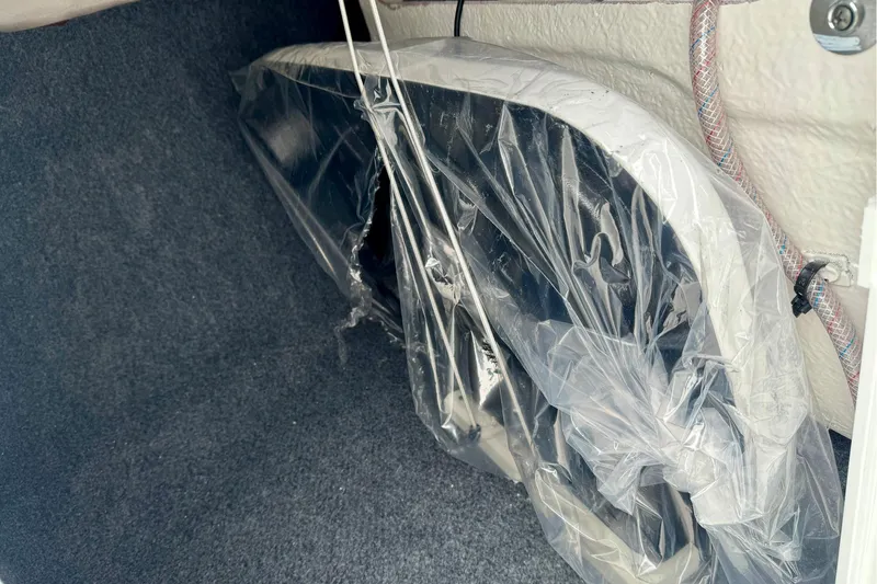 Slide: The Image of 2025 Yamaha Boats AR195 interior storage with wrapped components. - 29