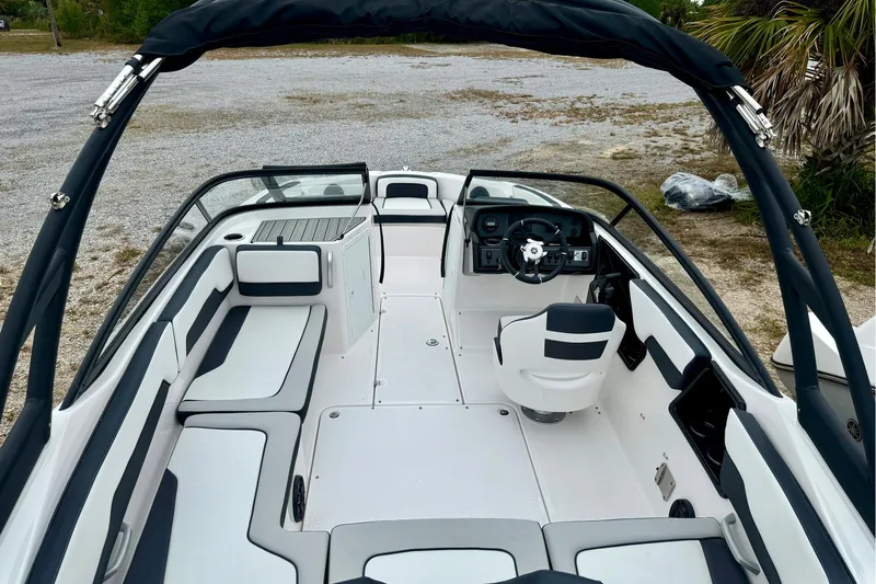 Slide: The Image of 2025 Yamaha Boats AR195 interior with sleek seating and modern dashboard design. - 32