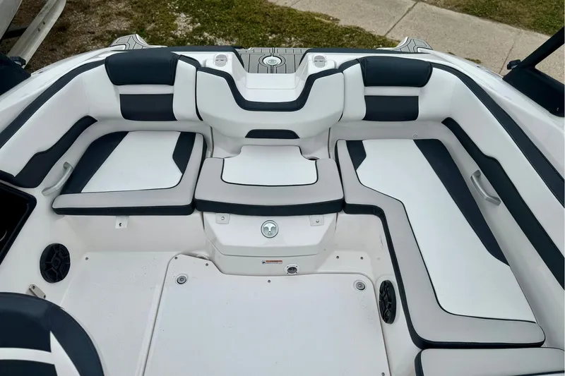 Slide: The Image of 2025 Yamaha Boats AR195 interior seating with sleek black and white design. - 33