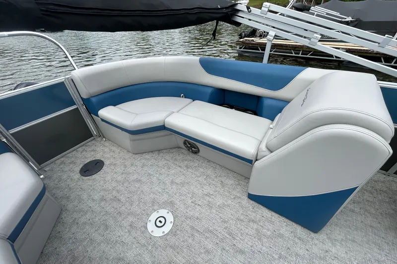 Slide: The Image of Luxurious seating on 2025 Southbay 224RSLE25 pontoon boat, featuring blue and gray upholstery. - 10