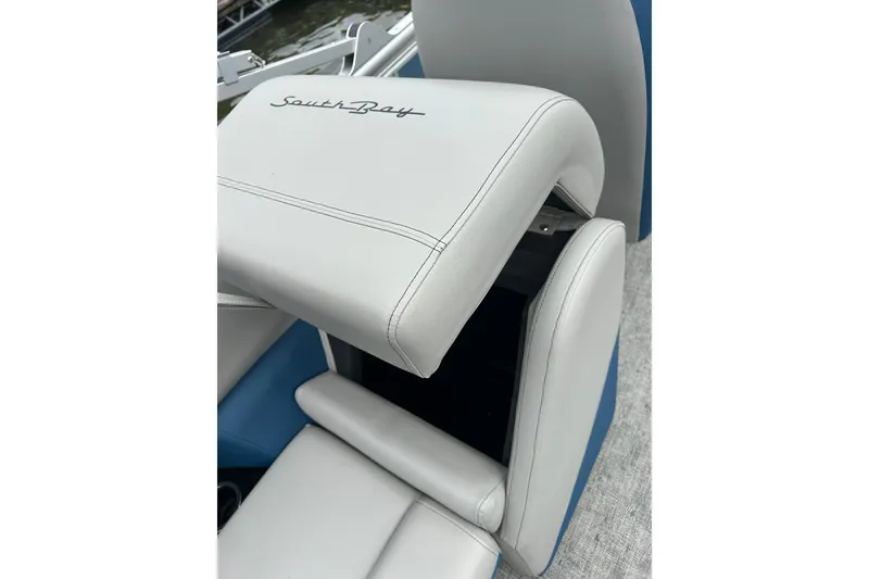 Slide: The Image of White leather seat with "SouthBay" logo on a 2025 Southbay 224RSLE25 boat. - 16