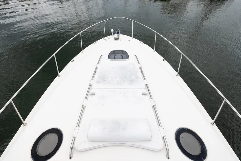 Slide: The Image of Bow view of 2007 Sea Ray 340 Sundancer yacht on calm water. - 12