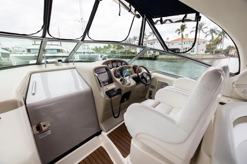 Slide: The Image of Interior view of 2007 Sea Ray 340 Sundancer yacht cockpit with steering wheel and controls. - 19