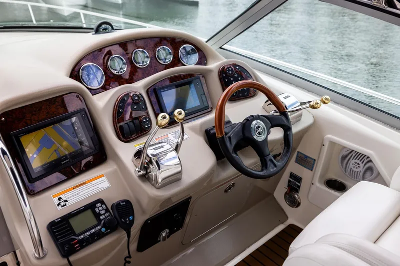 Slide: The Image of Cockpit of 2007 Sea Ray 340 Sundancer with navigation screens and controls. - 20