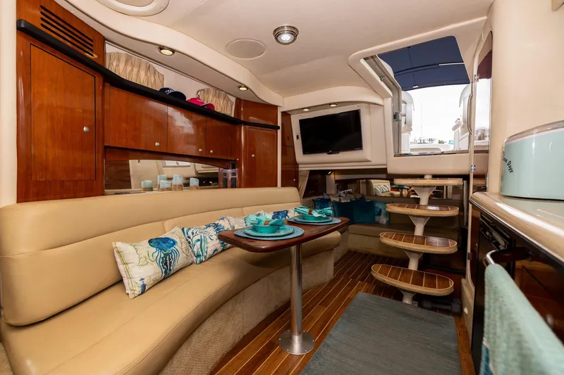 Slide: The Image of Luxurious interior of 2007 Sea Ray 340 Sundancer yacht with elegant seating and dining area. - 34