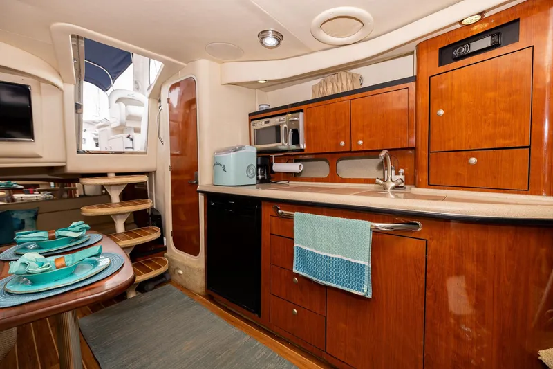 Slide: The Image of Luxurious 2007 Sea Ray 340 Sundancer yacht interior with modern kitchen and dining area. - 35