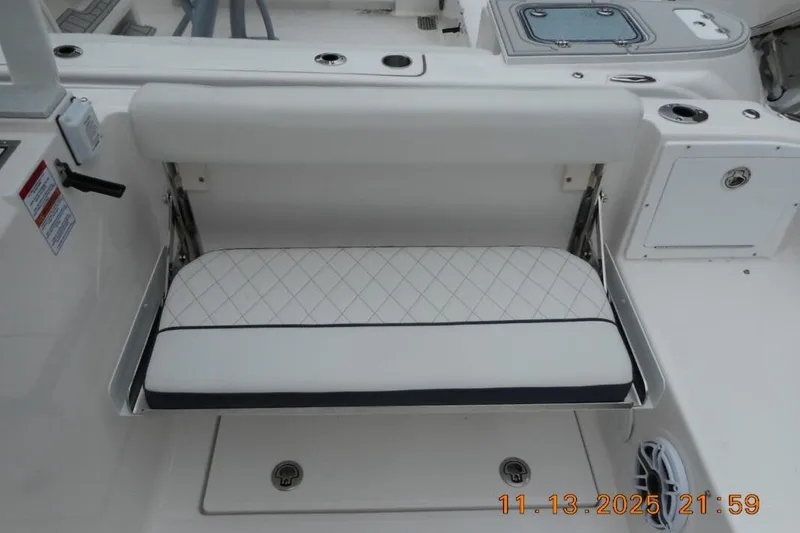 Slide: The Image of 2025 Sea Fox 288 Traveler boat seat with white cushioned upholstery and diamond pattern. - 11