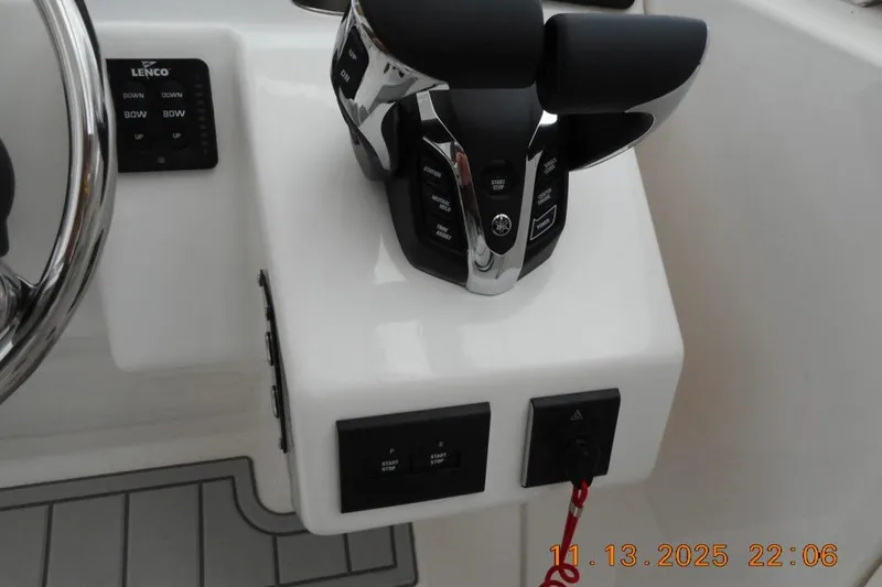 Slide: The Image of Control panel of 2025 Sea Fox 288 Traveler boat with throttle and steering wheel. - 15