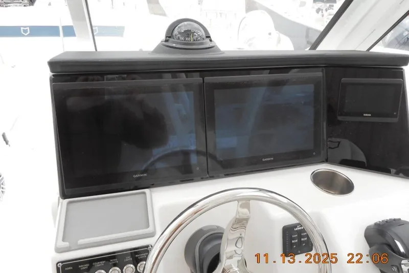 Slide: The Image of Helm of 2025 Sea Fox 288 Traveler with dual Garmin displays and compass. - 16