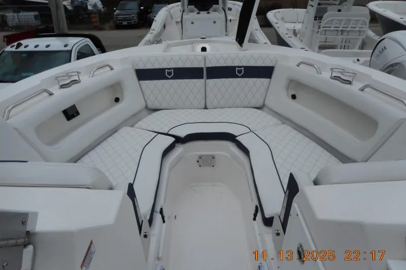 Slide: The Image of 2025 Sea Fox 288 Traveler boat interior with white cushioned seating and modern design. - 21