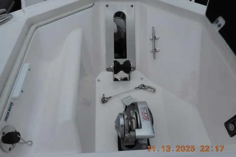 Slide: The Image of 2025 Sea Fox 288 Traveler boat anchor compartment with winch and cleat. - 22