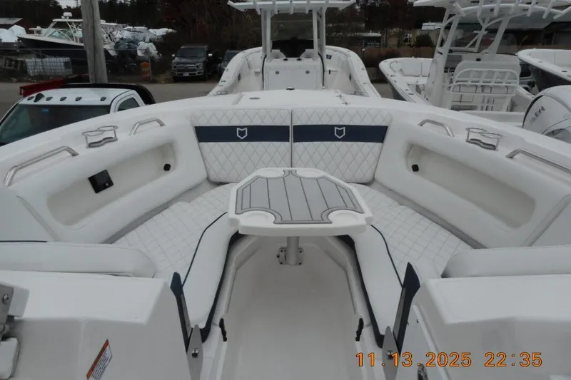 Slide: The Image of 2025 Sea Fox 288 Traveler boat interior with white seating and table. - 27