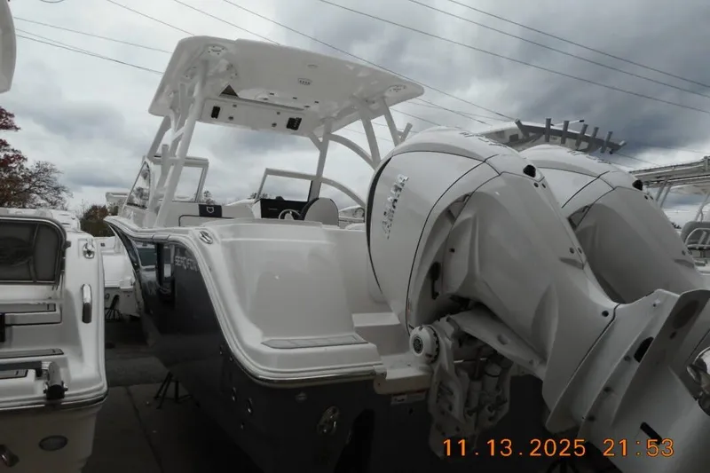 Slide: The Image of 2025 Sea Fox 288 Traveler boat with dual outboard engines under cloudy sky. - 3