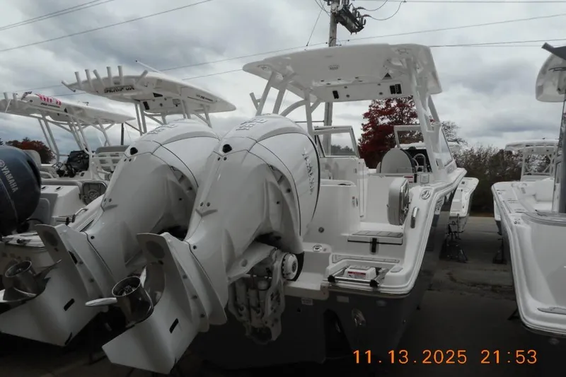 Slide: The Image of 2025 Sea Fox 288 Traveler boat with dual engines, displayed outdoors on a cloudy day. - 4