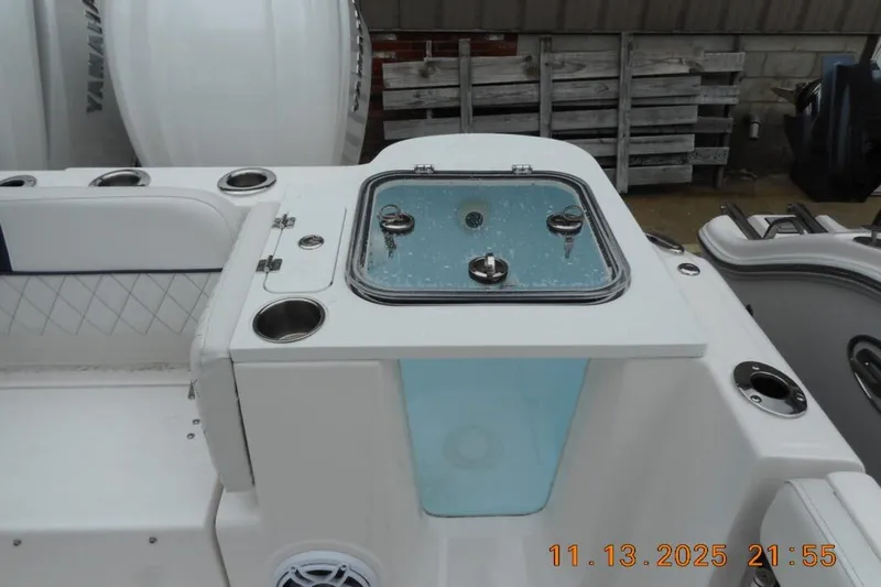 Slide: The Image of 2025 Sea Fox 288 Traveler boat interior with livewell and cup holders. - 8