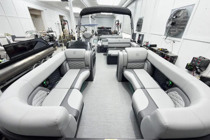 Slide: The Image of Luxurious interior of 2026 Godfrey Monaco 25' Tritoon with plush seating and modern design. - 11