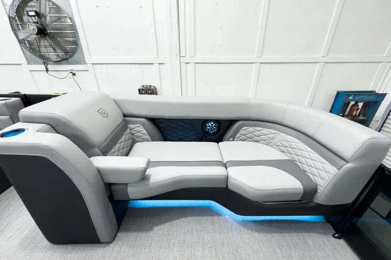 Slide: The Image of Luxurious seating on 2026 Godfrey Monaco 25' Tritoon, featuring elegant design and ambient lighting. - 13
