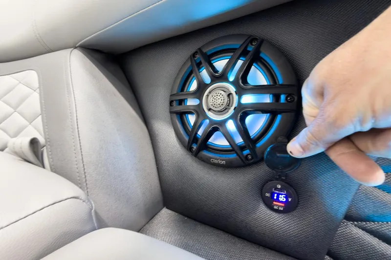 Slide: The Image of Speaker and USB port in 2026 Godfrey Monaco 25' Tritoon boat interior. - 16