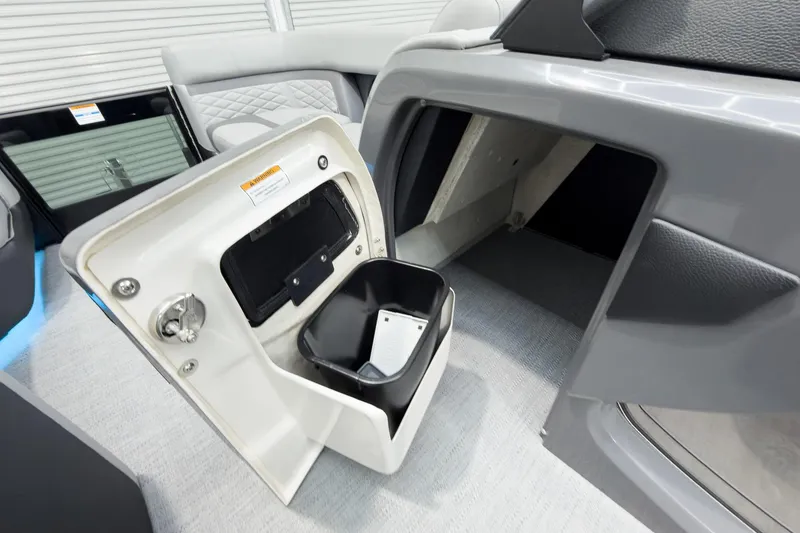 Slide: The Image of Interior storage compartment of 2026 Godfrey Monaco 25' Tritoon, featuring sleek design and practical utility. - 28