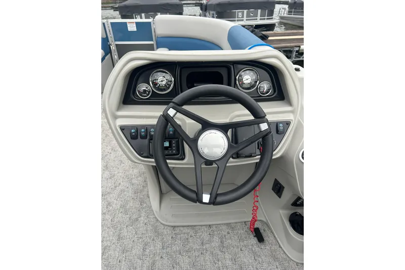 Slide: The Image of Steering console of 2025 Southbay 224RSLE275 boat with gauges and controls. - 15
