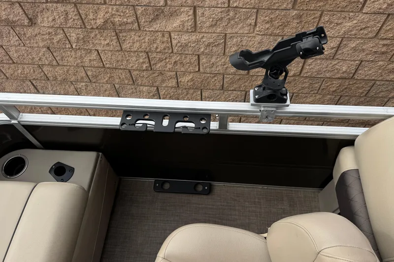 Slide: The Image of 2024 Sun Tracker SportFish 22 DLX interior with rod holder and seating. - 22