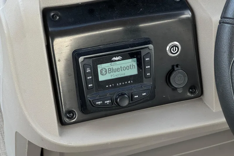 Slide: The Image of Bluetooth stereo system on 2024 Sun Tracker SportFish 22 DLX boat dashboard. - 28