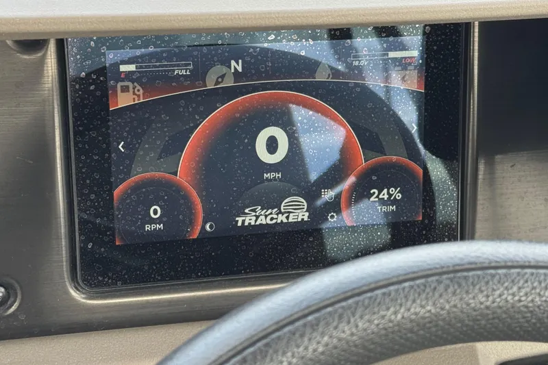 Slide: The Image of Dashboard display of 2024 Sun Tracker SportFish 22 DLX showing speed, RPM, and trim. - 29