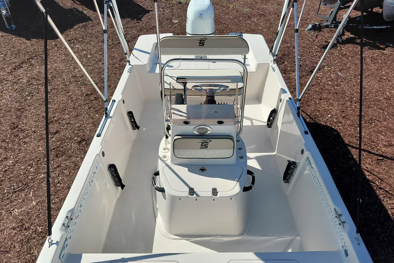 Slide: The Image of 2022 Carolina Skiff 178 JLS boat interior with steering console and seating. - 15