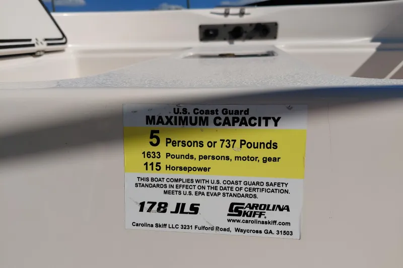 Slide: The Image of 2022 Carolina Skiff 178 JLS capacity label, 5 persons or 737 pounds, 115 horsepower. - 18