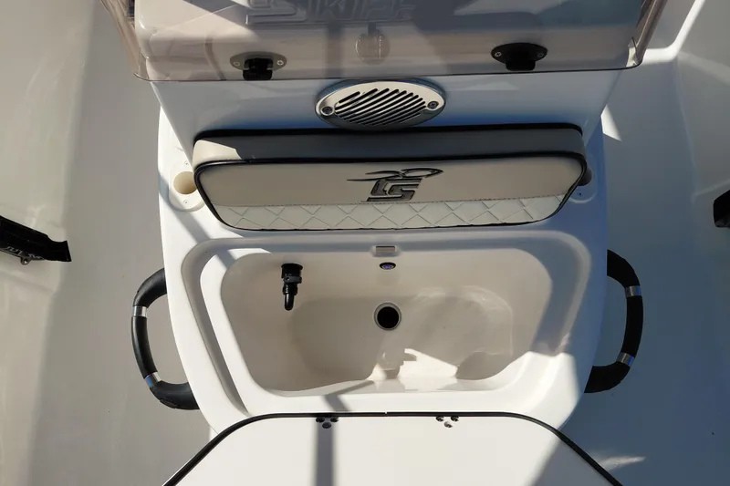 Slide: The Image of 2022 Carolina Skiff 178 JLS boat interior with storage compartment and speaker. - 20