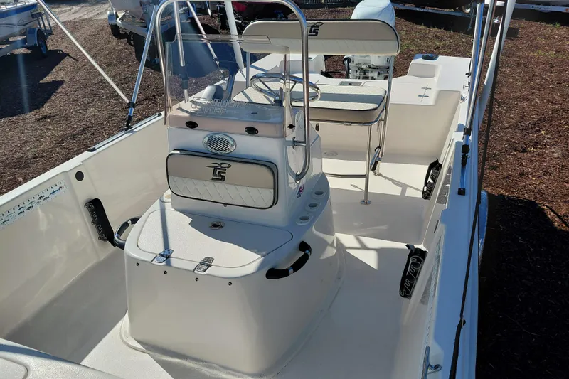 Slide: The Image of 2022 Carolina Skiff 178 JLS boat interior with seating and steering console. - 21