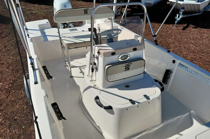 Slide: The Image of 2022 Carolina Skiff 178 JLS boat interior with steering console and seating. - 22