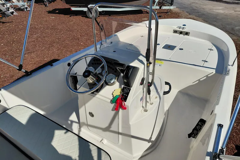 Slide: The Image of 2022 Carolina Skiff 178 JLS boat interior with steering wheel and controls. - 24