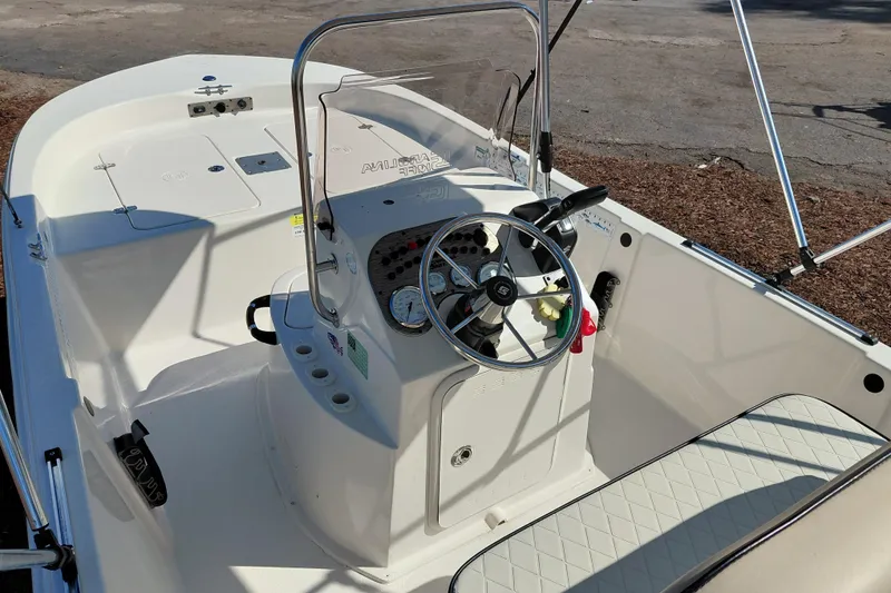 Slide: The Image of 2022 Carolina Skiff 178 JLS boat interior with steering console and seating. - 25