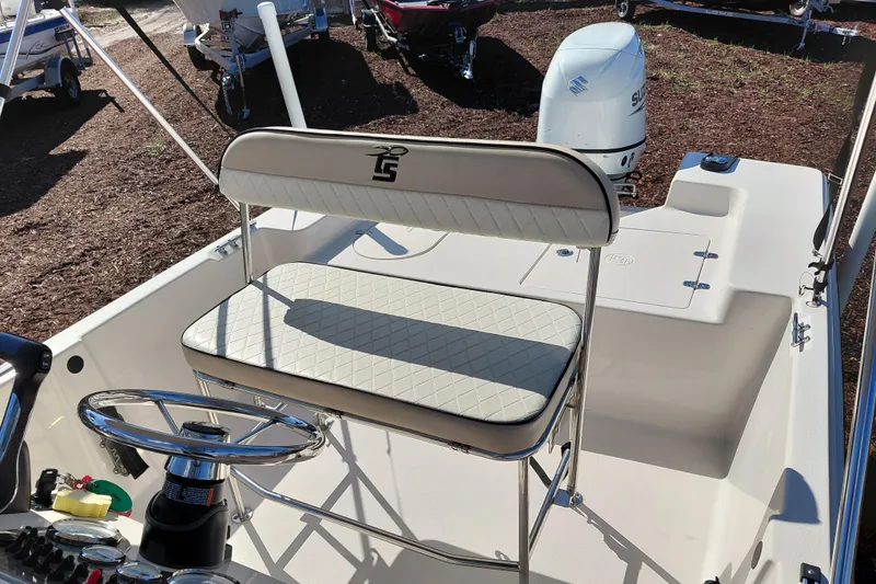Slide: The Image of 2022 Carolina Skiff 178 JLS boat interior with steering wheel and seating. - 29