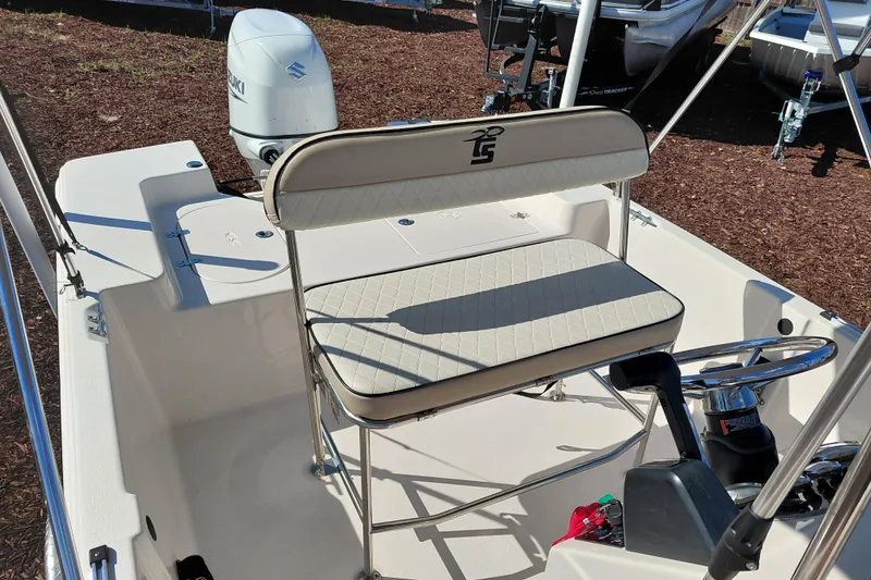 Slide: The Image of 2022 Carolina Skiff 178 JLS boat interior with seating and steering console. - 30