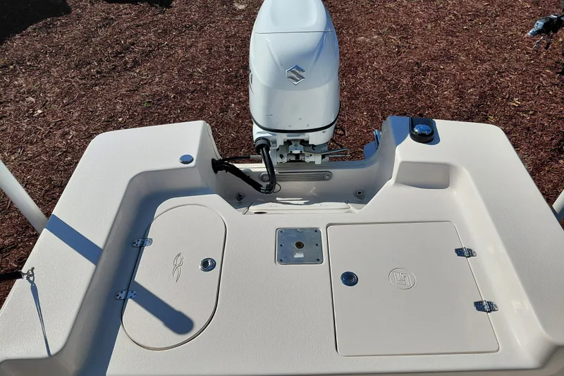 Slide: The Image of 2022 Carolina Skiff 178 JLS boat stern with Suzuki outboard motor. - 31
