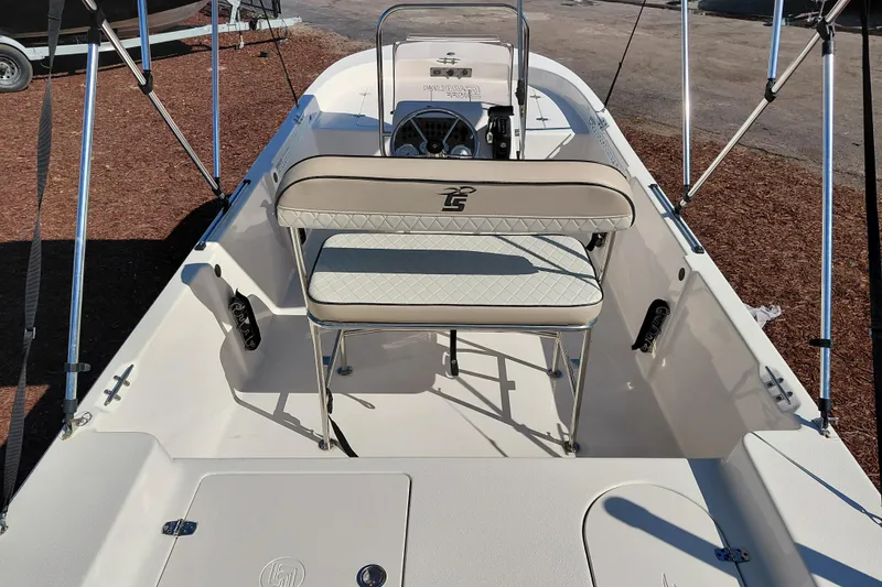 Slide: The Image of 2022 Carolina Skiff 178 JLS boat interior with seating and steering console. - 34