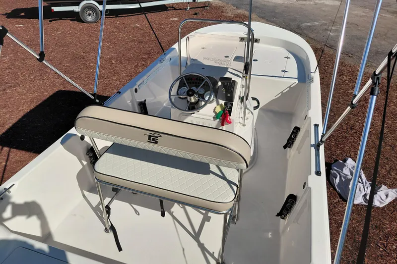 Slide: The Image of 2022 Carolina Skiff 178 JLS boat interior with steering console and seating. - 37