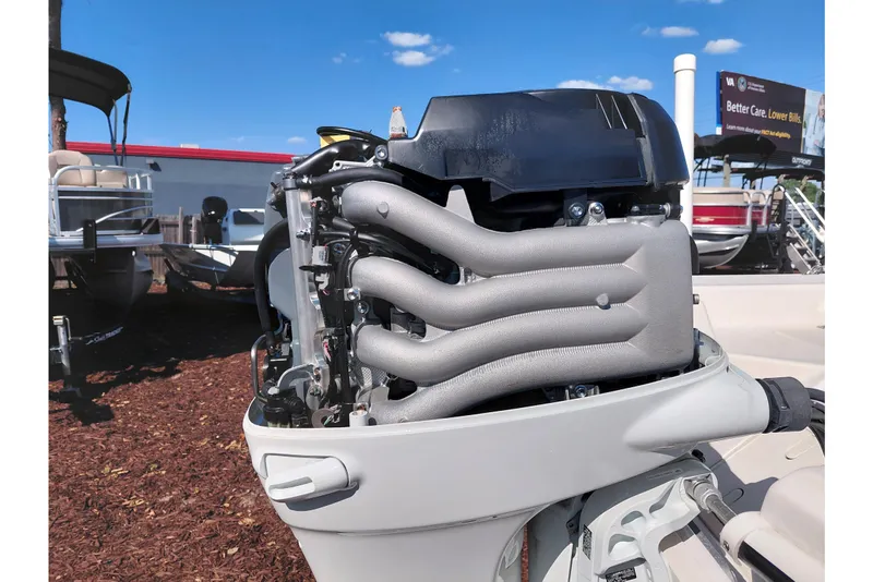 Slide: The Image of 2022 Carolina Skiff 178 JLS boat engine, detailed view under sunny sky. - 40