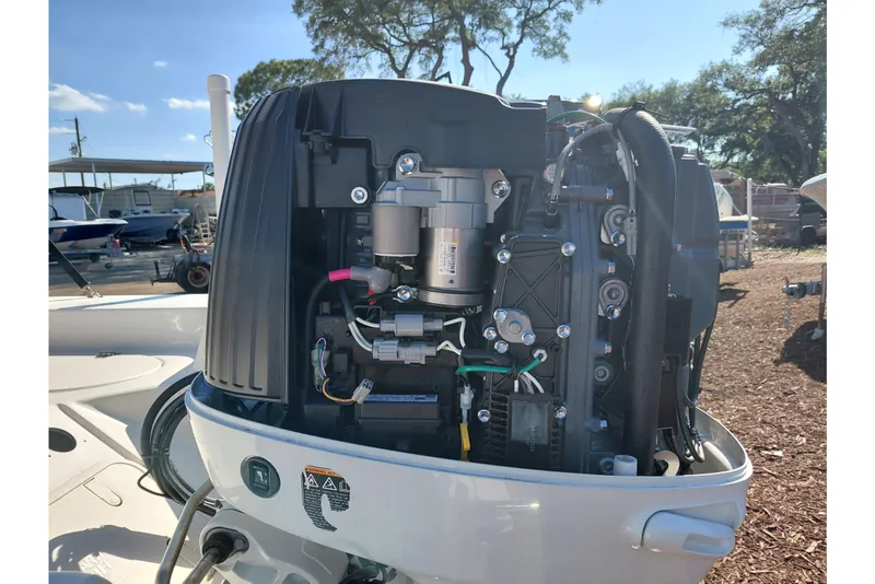 Slide: The Image of 2022 Carolina Skiff 178 JLS boat engine, detailed view in outdoor setting. - 41