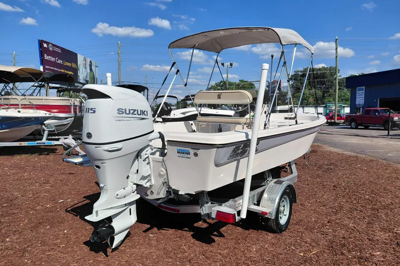 Slide: The Image of 2022 Carolina Skiff 178 JLS boat with Suzuki outboard motor on display outdoors. - 7