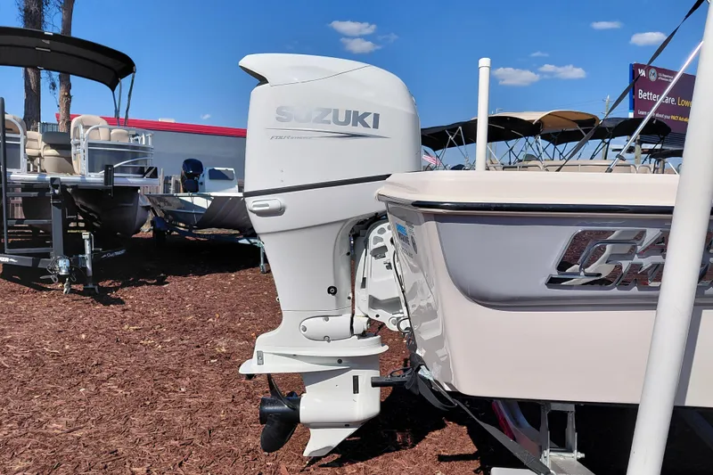Slide: The Image of 2022 Carolina Skiff 178 JLS boat with Suzuki outboard motor displayed outdoors. - 9