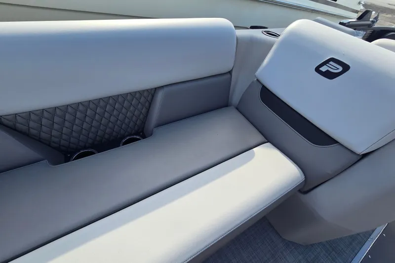 Slide: The Image of 2026 Princecraft Vectra 23 RL boat interior with gray seating and cup holders. - 12