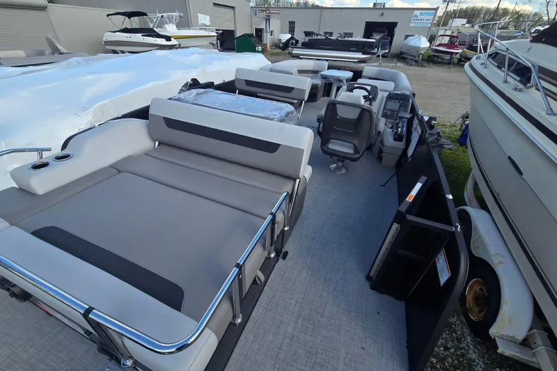 Slide: The Image of 2026 Princecraft Vectra 23 RL pontoon boat interior with seating and helm. - 4